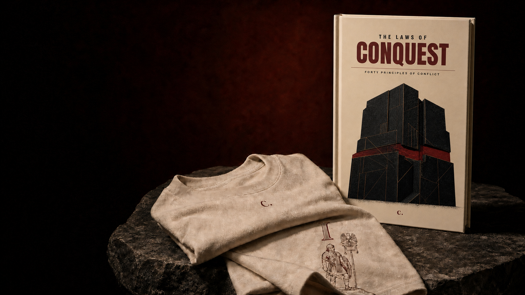 The monumental-building Laws of Conquest cover beside a C. marked Salt tee and Law I back artwork